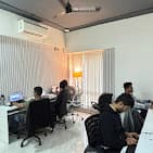 Small team gathered at the LearnSynaptic office