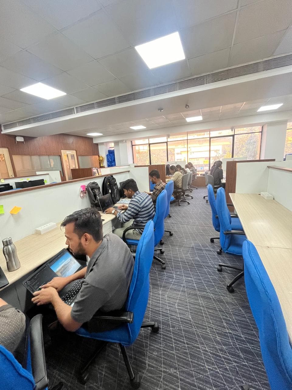 LearnSynaptic team members working at their desks